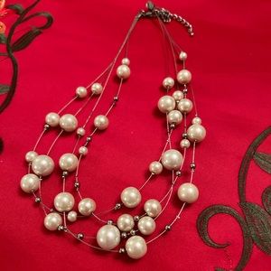 Three tier pearl necklace.
